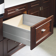 Cabinet drawer open to show metal box