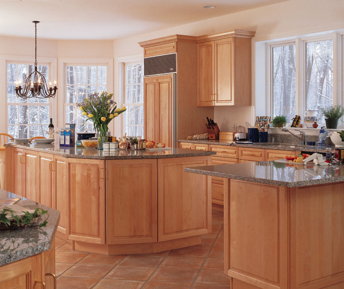 Light maple cabinets in kitchen by Kitchen Craft Cabinetry