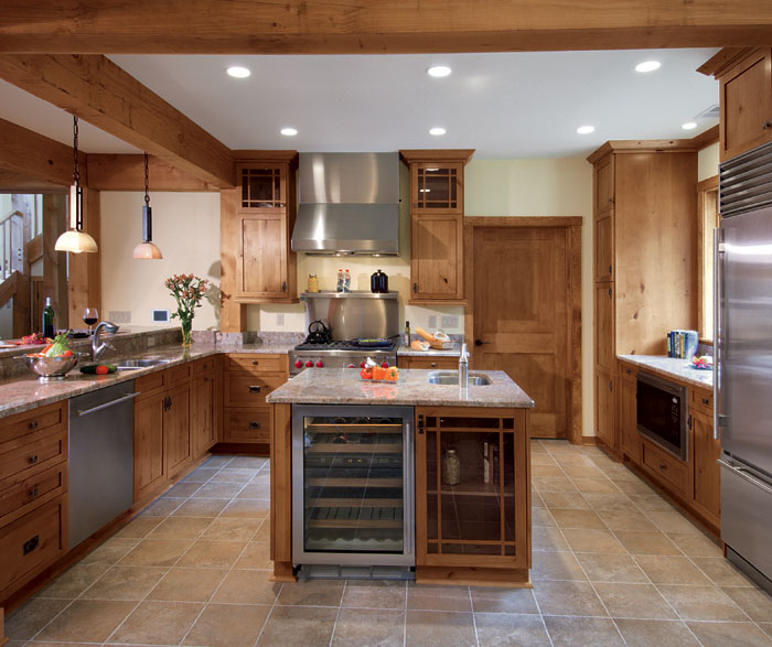 Knotty alder kitchen cabinets in natural finish by Kitchen Craft Cabinetry